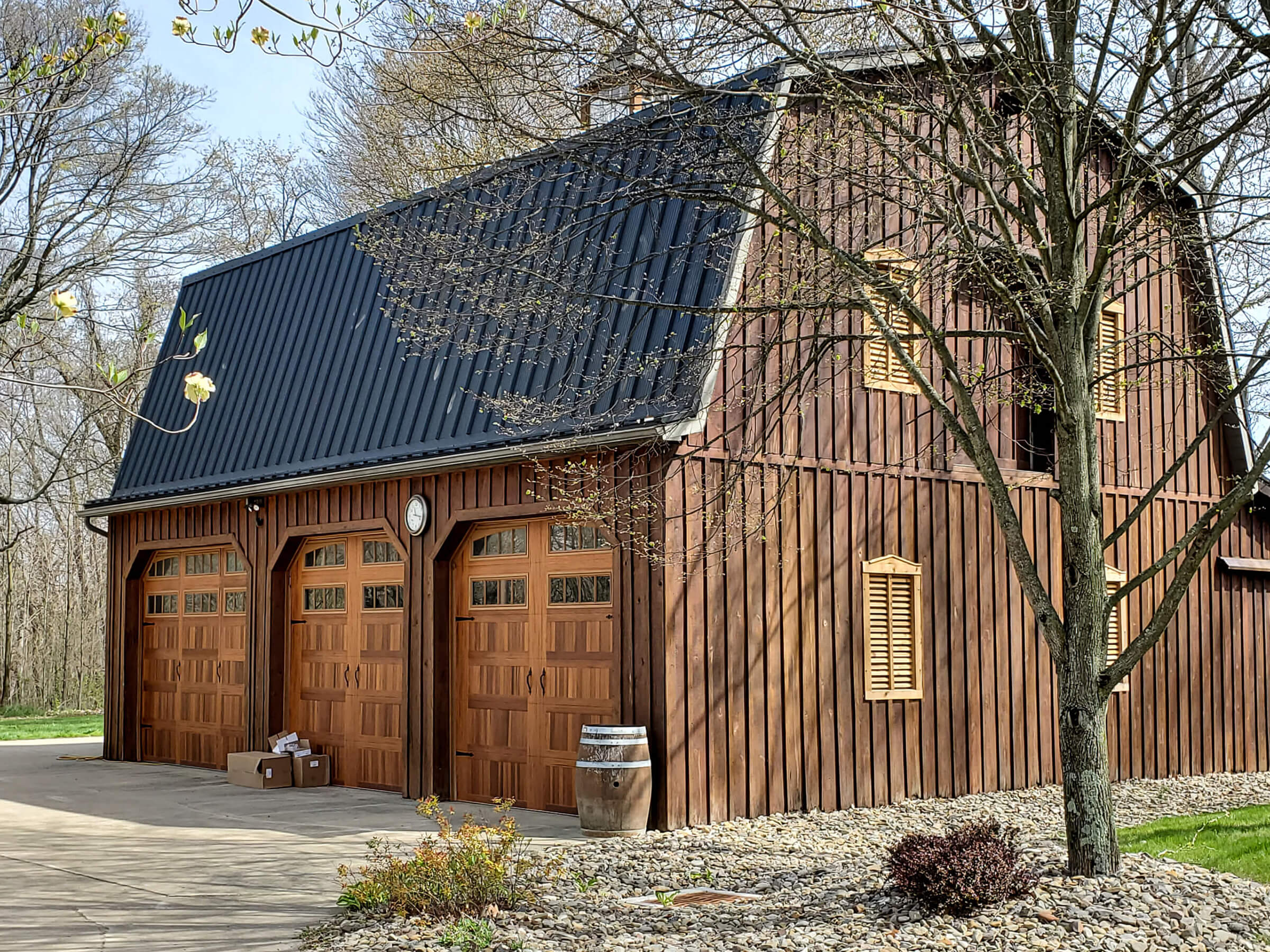 barn style structure with black metal roof